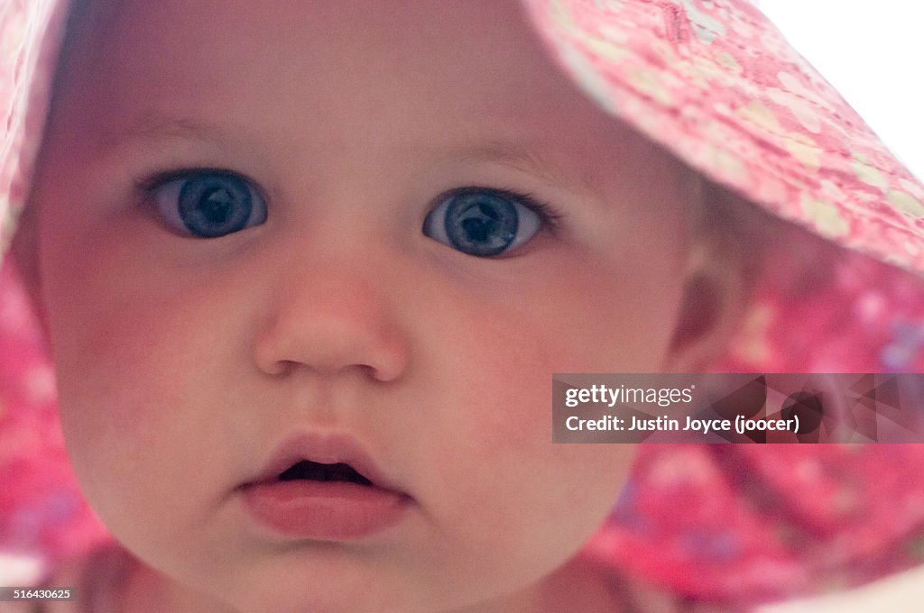 Close up of girl wearing pink hat