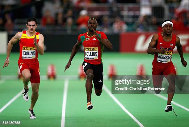 Bruno Hortelano of Spain, Kim Collins of Saint Kitts and Nevis and Mike Rodgers of the United States compete in the Men's 60 Metres Semi-Final during...