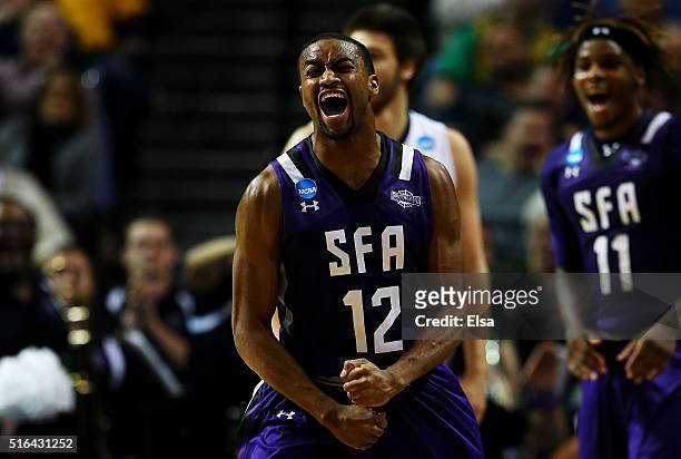Dallas Cameron of the Stephen F. Austin Lumberjacks celebrates in the second half against the West Virginia Mountaineers during the first round of...