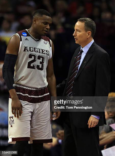 Head coach Billy Kennedy of the Texas A&M Aggies talks with Danuel House in the second half against the Green Bay Phoenix during the first round of...