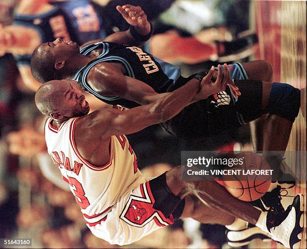 Michael Jordan of the Chicago Bulls steals the basketball from Cleveland Cavaliers guard Mitchell Butler during the first quarter of the 15 November...