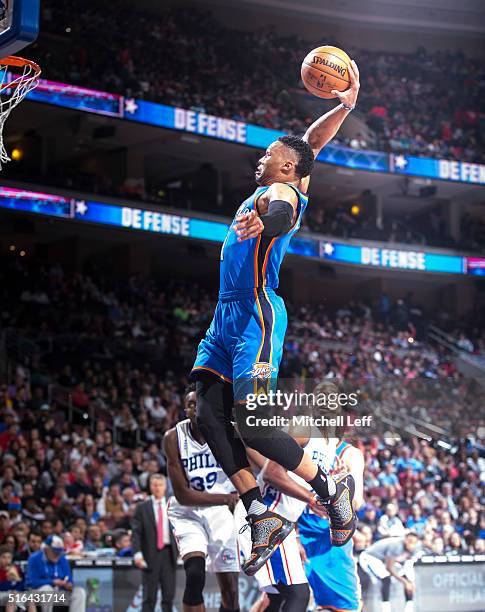 Russell Westbrook of the Oklahoma City Thunder dunks the ball against the Philadelphia 76ers on March 18, 2016 at the Wells Fargo Center in...