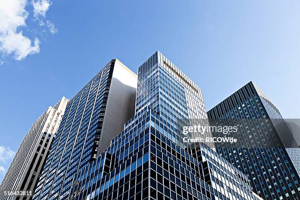 office tower in new york city - directly below sky cloud stock pictures, royalty-free photos & images