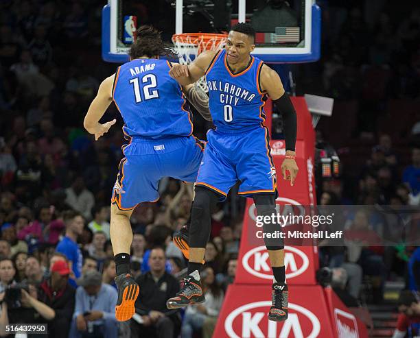 Russell Westbrook and Steven Adams of the Oklahoma City Thunder celebrate against the Philadelphia 76ers on March 18, 2016 at the Wells Fargo Center...