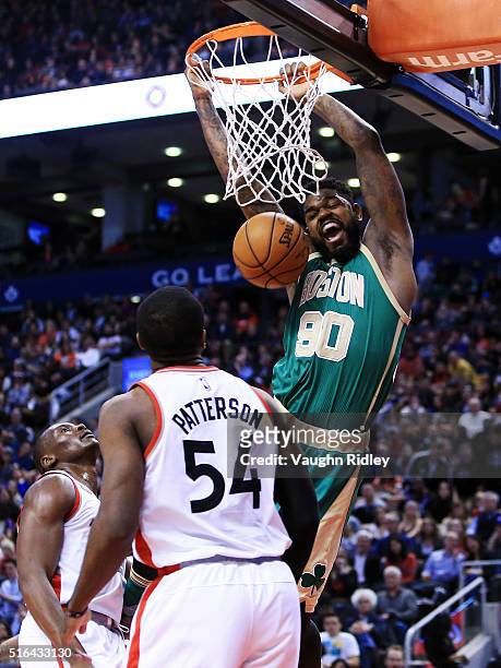 Amir Johnson of the Boston Celtics dunks the ball during the second half of an NBA game against the Toronto Raptors at the Air Canada Centre on March...