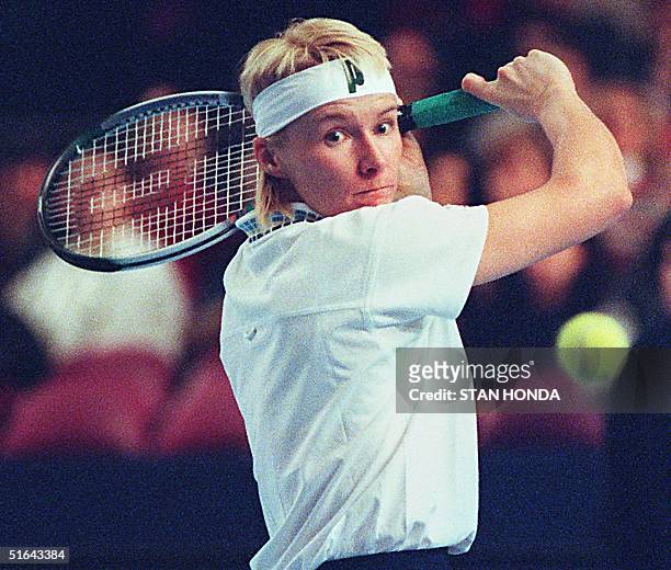 Second-seeded Jana Novotna of the Czech Republic hits a backhand to seventh-seeded Mary Pierce of France on her way to victory in the finals of the...