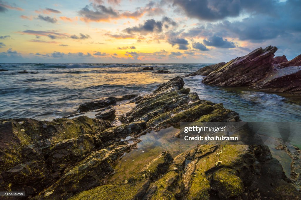 Beach with rocks, waves stream in Terengganu, Malaysia