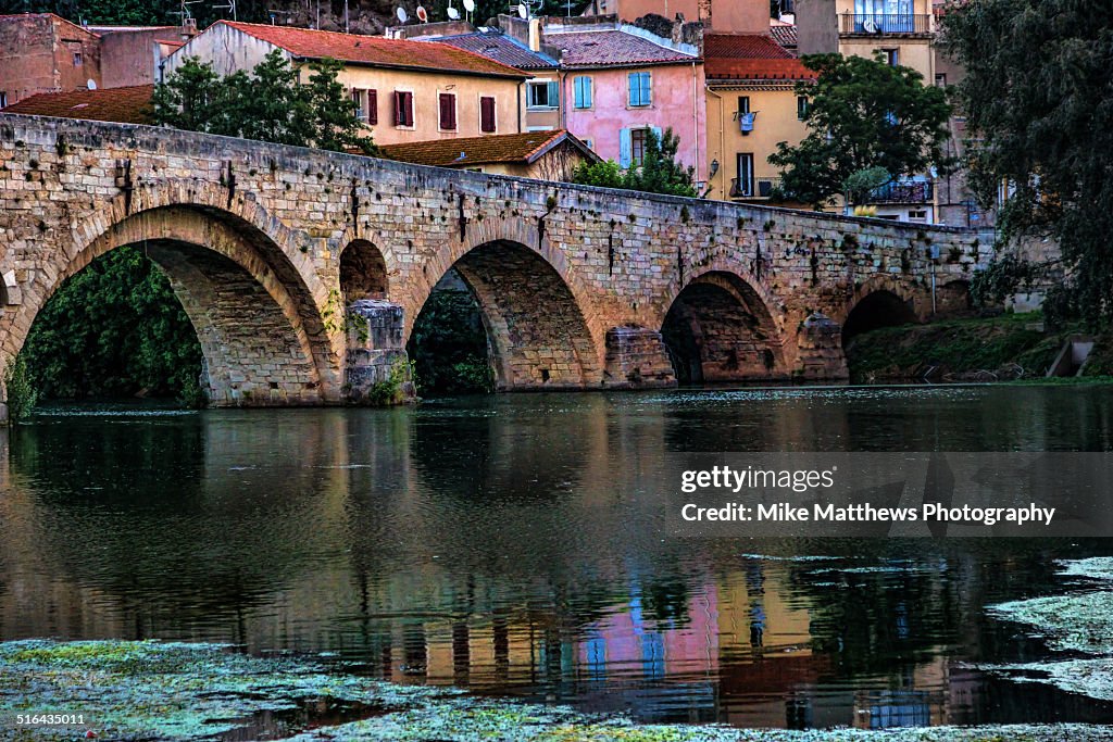 Reflections under a bridge