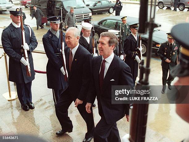 Defense Secretary William Cohen escorts Minister of National Defense, Kim Dong Jin, of the Republic of Korea, through a US Military honor cordon 09...