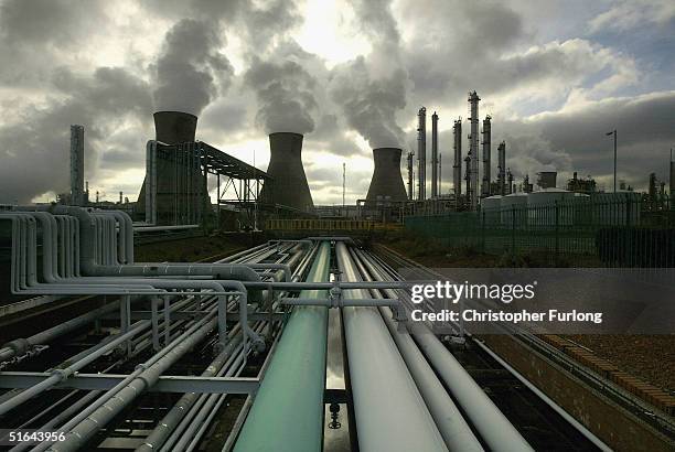 middle east instability props oil price close to all time high - cooling tower stock pictures, royalty-free photos & images