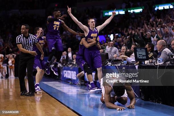 Isaiah Taylor of the Texas Longhorns reacts after Paul Jesperson of the Northern Iowa Panthers hit a half court three pointer to win the game with a...