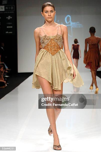 Model Larissa Castro wears a garment by Brazilian designer Marcia Ganem during the 2005 Spring/Summer collection Fashion Rio Summer 2005, in Rio de...
