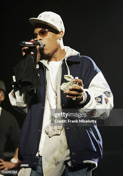 Special guest rapper TI performs on the "Best of Both Worlds" tour, November 1, 2004 at Madison Square Garden in New York City. The tour was...