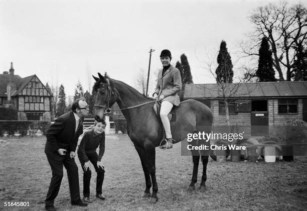 English comedian Eric Morecambe at his home in Harpenden, Hertfordshire with his son 13 year old son Gary and 15 year old daughter Gail, who is...