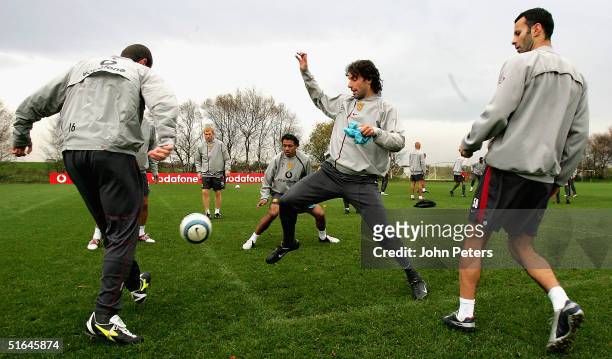 Roy Keane, Ruud van Nistelrooy and Ryan Giggs of Manchester United in action during a first team training session ahead of the UEFA Champions League...