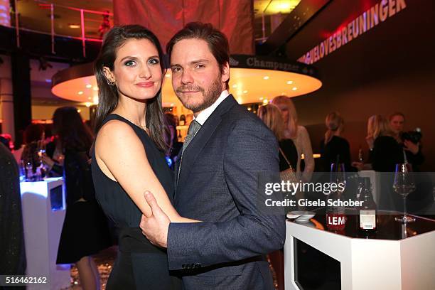 Daniel Bruehl and his girlfriend Felicitas Rombold during the 'Vogue loves Breuninger' fashion event on March 18, 2016 in Stuttgart, Germany.