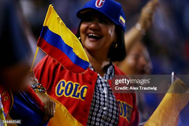 Fan of Team Colombia waves a flag during Game 3 of the World Baseball Classic Qualifier against Team Panama at Rod Carew Stadium on Friday, March 18,...