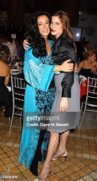 Nancy Dell'Olio and Vanessa Neumann attend a charity sports quiz at the Royal Exchange on November 1, 2004 in London. The evening, which included a...