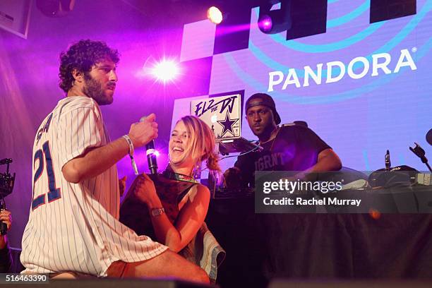 Rapper Lil Dicky and volunteer SXSW-er perform a mock 'lap dance' onstage during the PANDORA Discovery Den SXSW on March 18, 2016 in Austin, Texas.