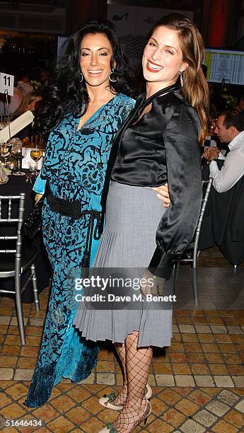 Nancy Dell'Olio and Vanessa Neumann attend a charity sports quiz at the Royal Exchange on November 1, 2004 in London. The evening, which included a...