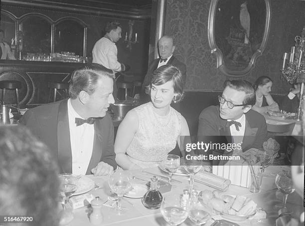 Wyatt Cooper chatting with Gloria Vanderbilt and her husband Sidney Lumet at El Morocco Nightclub, 154 East 54th Street, New York City.