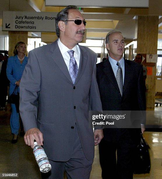 Mark Geragos and Pat Harris , attorneys for accused double-murderer Scott Peterson, enter the San Mateo County Superior Courthouse for closing...