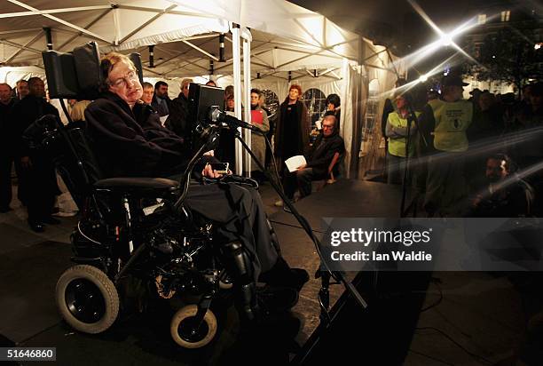 Scientist Stephen Hawking reads out names during a vigil at Trafalgar Square at which a list of names of people killed in the Iraq war is read out...