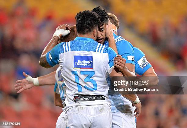 Lolagi Visinia of the Blues celebrates a try by team mate Ihaia West during the round four Super Rugby match between the Reds and the Blues at...