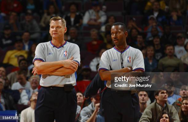 Referees observe the game between the Utah Jazz and the Detroit Pistons during the preseason game at The Palace of Auburn Hills on October 24, 2004...
