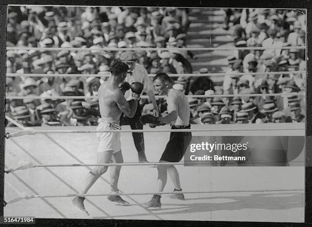 Fifth-round action. Tommy Gibbons ready to lead and Jack Dempsey guarding.