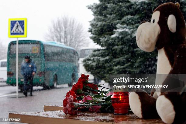 Toy and flowers lie on stairs of the airport in Rostov-on-Don where a plane crashed killing all 62 people onboard on March 19, 2016. The plane, which...