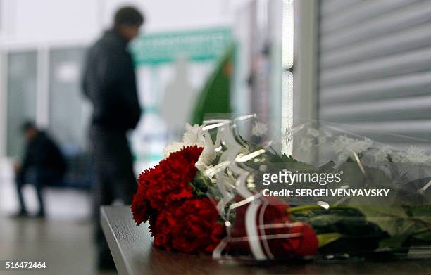Flowers lie on a desk inside of the airport building in Rostov-on-Don where a plane crashed killing all 62 people onboard on March 19, 2016. The...