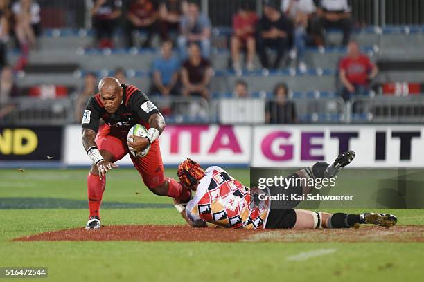 Nemani Nadolo of the Crusaders is tackled by Steven Sykes of the Kings during the round four Super Rugby match between the Crusaders and the Kings at...