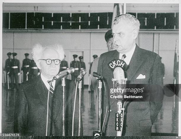 Honorable John Diefenbaker, Prime Minister of Canada, shown greeting Prime Minister of Israel David Ben Gurion on his arrival at Ottawa this morning.