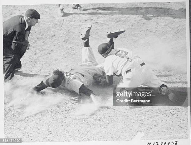 Boston, Massachusetts: Irv Noren, New York Yankee outfielder, is out at home despite a desperate head first slide in the sixth inning of the game...