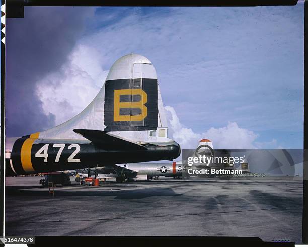 The tails of the four superforts that participated in the atom bomb test on July 1st, are shown in this photo mad eon the airstrip on Kwajalein. Each...