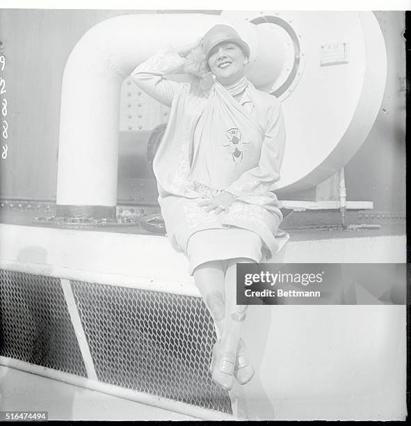 Famous Actress On Arrival Shows New Stocking Pictures Of Self And Hubby. Photo shows Irene Bordoni, on S. S. Paris arrival, with picture of herself...