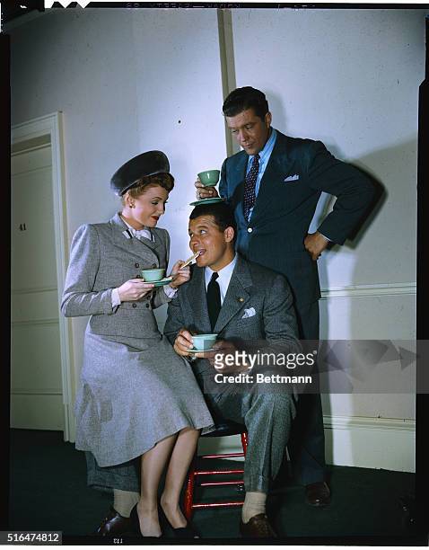 Dennis Morgan, Jack Carson, and Joan Leslie between scenes of Warner Bros. Two Guys from Milwaukee, directed by David Butler.