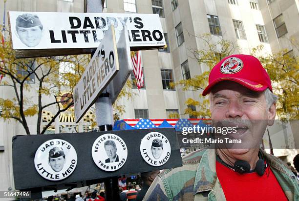 Bob McLane of Streetport, Louisiana sells bumper stickers and buttons that mock U.S. President George W. Bush at Rockefeller Center November 2, 2004...