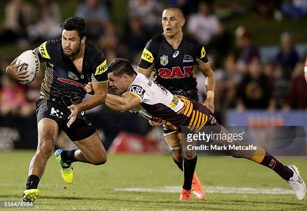 Peta Hiku of the Panthers is tackled by James Roberts of the Broncos during the round three NRL match between the Penrith Panthers and the Brisbane...