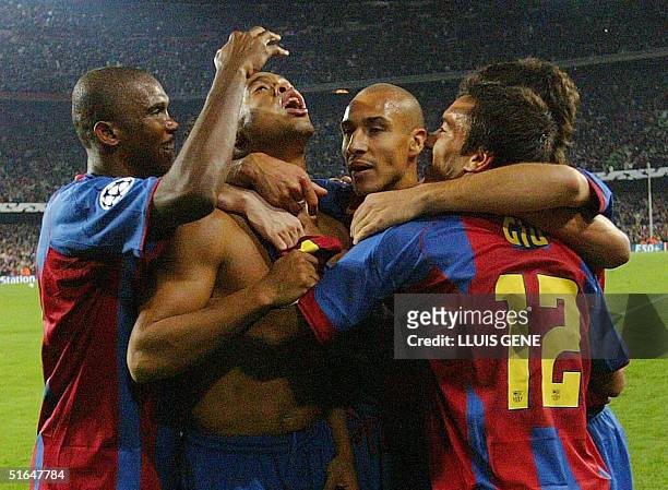 Barcelona's Eto'o of Cameroon,Brazilian Ronaldinho, Swedish Henrik Larson, and Dutch Gio celebrate after scoring the second goal against AC Milan...