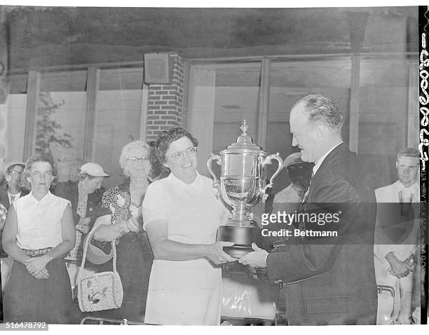 Fay Crocker receives trophy after winning U.S. Women's Open golf tourney. Presentation made by John D. Ames, vice president of U.S.G.A. Of Chicago.