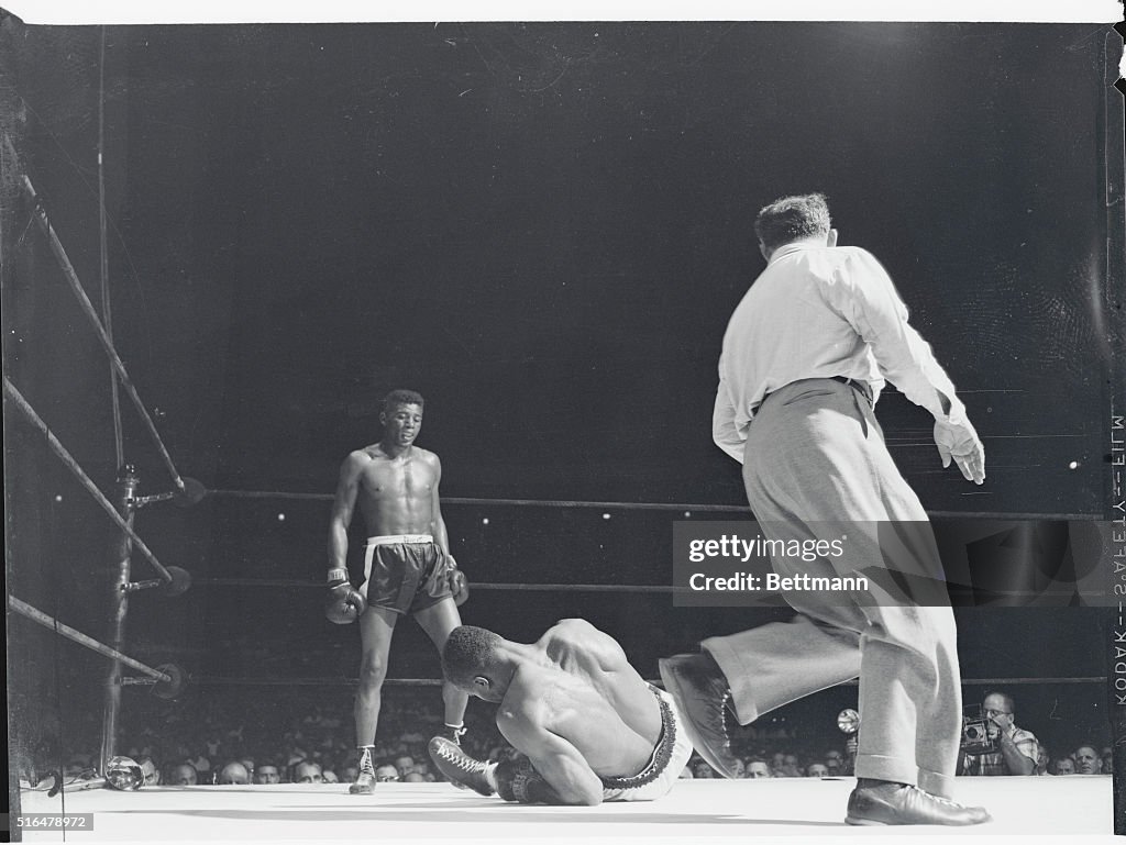 Archie McBride Falling Down onto Ring Canvas