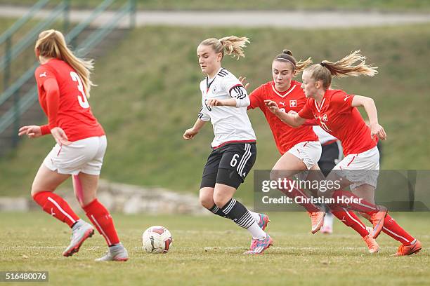 Lisa Schoeppl of Germany competes for the ball with Alicia Haller and Rahel Tschopp of Switzerland during the U17 Girl's Euro Qualifier match between...