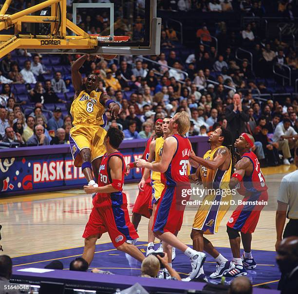 Kobe Bryant of the Los Angeles Lakers dunks during a preseason game against the Los Angeles Clippers at Staples Center on October 22, 2004 in Los...