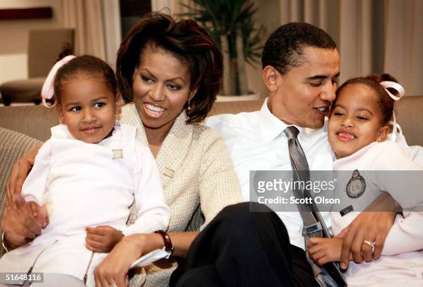Candidate for the U.S. Senate Barack Obama sits with his wife Michelle and daughters Sasha and Malia in a hotel room as they wait for election...