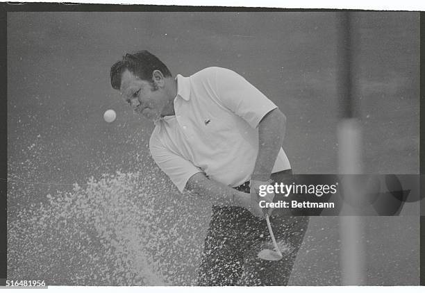 Augusta, Georgia: In a whirl of sand, Orville Moody of Yukon, Oklahoma, blasts his way out of a trap on number two during the second round of play.