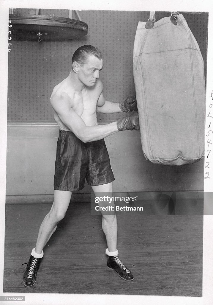 Eugene Criqui Hitting Punching Bag