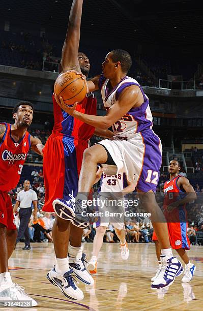 Howard Eisley of the Phoenix Suns looks to make a pass play against the Los Angeles Clippers on October 13, 2004 at America West Arena in Phoenix,...