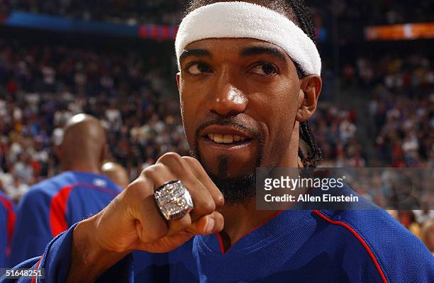 Richard Hamilton of the Detroit Pistons shows off his 2004 NBA Championship ring prior to the game against the Houston Rockets on November 2, 2004 at...